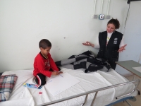 WHO Jordan’s Dr Rana Almosoukar asks young patient Bilal (5) what he is going to draw