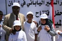 WHO Representative Dr Hassan El Bushra with three children