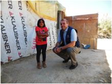 Dr Balladelli, WHO Regional Emergency Coordinator,  with Marah, a Syrian refugee, at a refugee settlement in Tripoli, Lebanon