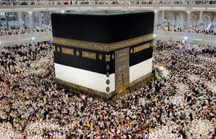 Pilgrims walk around the Ka'aba at the centre of Islam's most sacred mosque Al Masjid Al Haram in Mecca Saudi Arabia