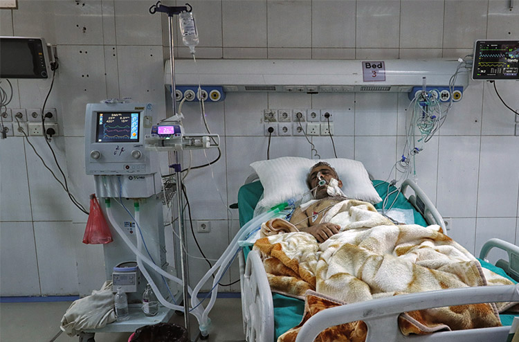 Patient in Al Thawra hospital receives treatment. The oxygen supply newly provided to the intensive unit where he is being treated is crucial to saving his life