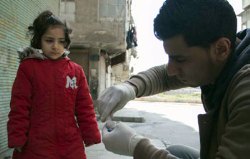 Syrian girl waiting for vaccination