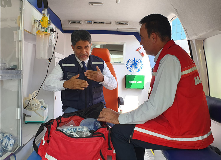 With a paramedic in a new ambulance donated by WHO to the Ministry of Health of Iraq