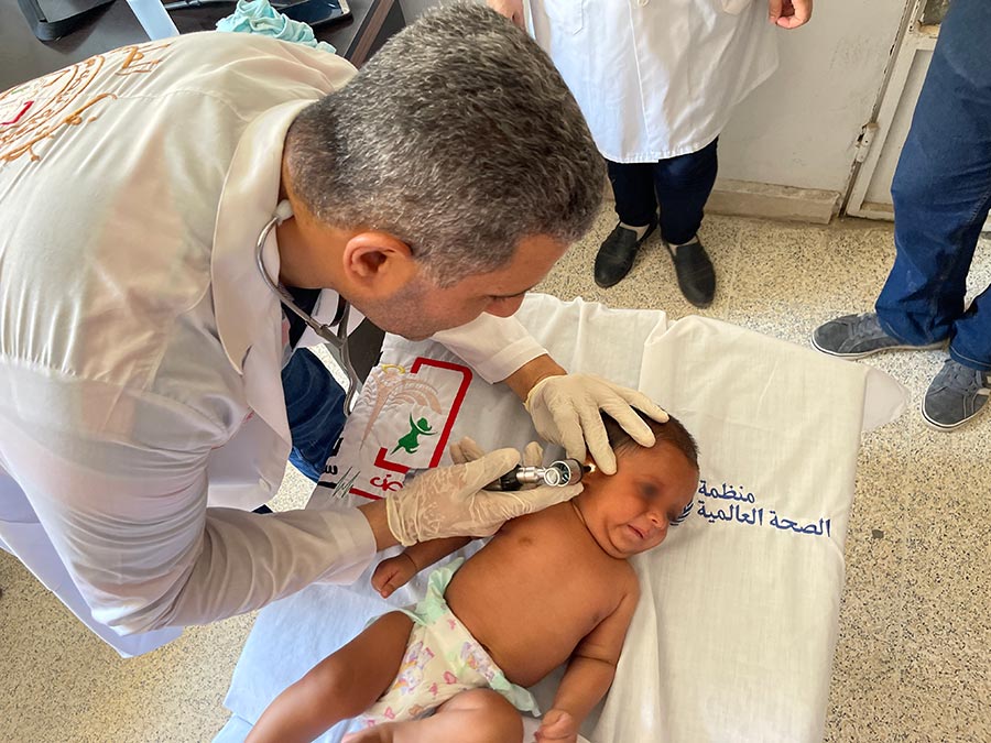 3-month baby receiving pediatric health services at WHO-supported health center in Deir-Ez-Zor, Syrian Arab Republic