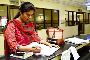 Dr Ujala checking the register to look for AFP cases