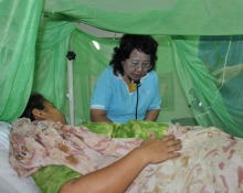 A doctor examining a dengue fever patient in lahore