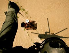 A villager is rescued by helicopter during the floods in Pakistan in 2010 