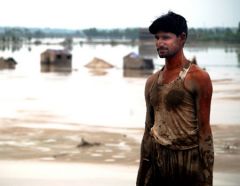 A man surveys the damage during the floods in Pakistan in 2010