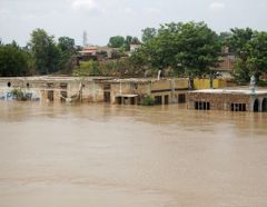 Houses almost submerged by the flood water in Pakistan in 2010