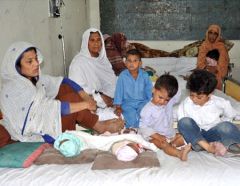 People sheltering in a refurbished health facility in Nowsehra district in Khyber Pakhtunkhwa, Pakistan