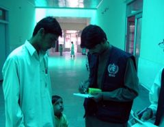 The WHO pharmacist conducting an interview with a patient 