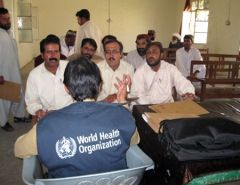 Participants in discussion in a  training room