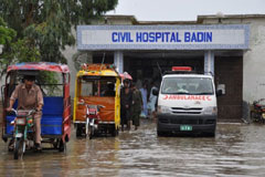 A civil hospital is overwhelmed by flood water in Badin, Sindh 