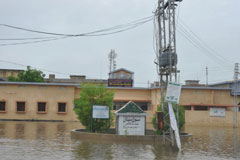 A civil hospital is overwhelmed by flood water in Sanghar, Sindh