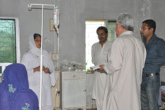 WHO’s disease early warning system (DEWS) team meet with medical staff of a civil hospital in Sanghar, Sindh