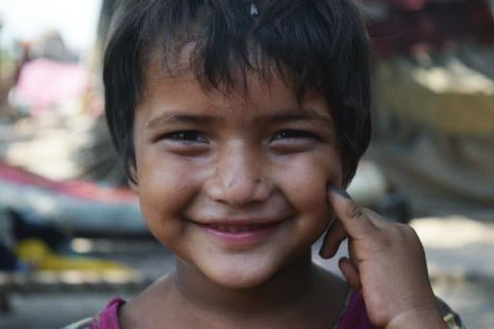 A girl posing with her finger marking in Samanabad Town, Lahore. WHO/A.S.Khan