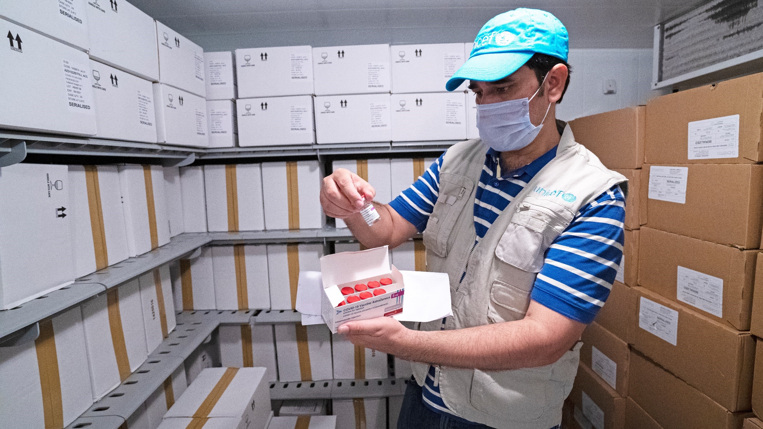 unicef-officer-inspects-vaccines