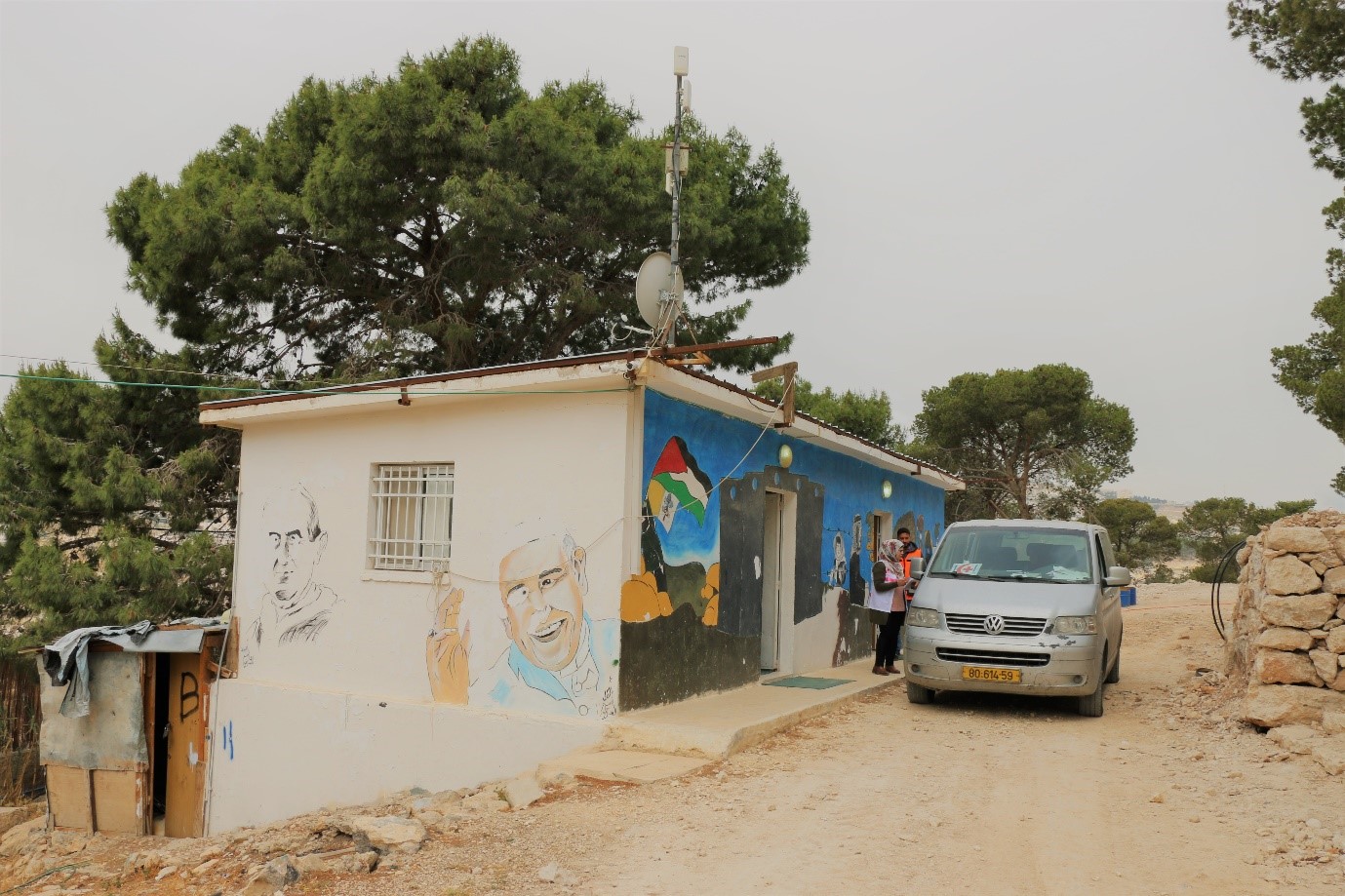 Mobile health team outside the community centre at Jabal al Baba