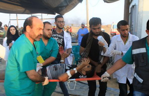 Injured boy carried on stretcher during Gaza demonstrations