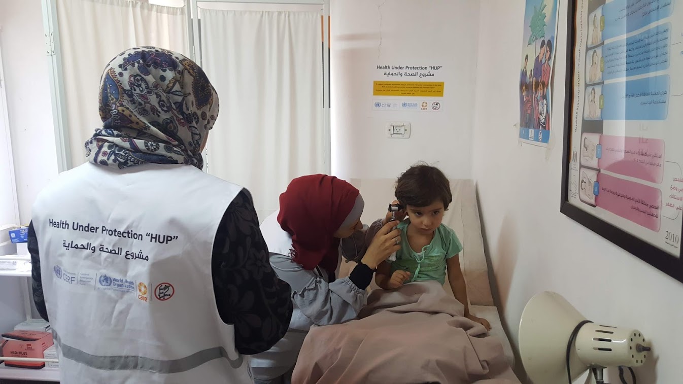 A child gets medical check up at the mobile clinic in Kherbet Zakhariya. Credit: WHO