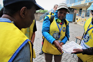 Julia Kimutai and her team consult the micro-plan before beginning immunization activities 