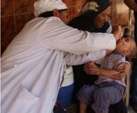 Health team vaccinating a child during April 2012 national immunization day (NID) in Egypt