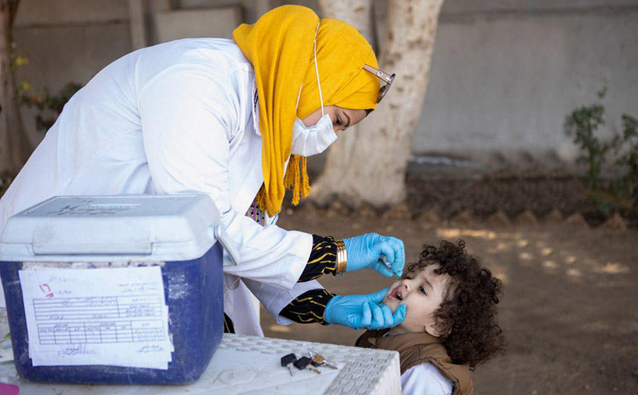 A child is vaccinated during the first round of polio response campaign in Egypt targeting 16.6 million children under age five.
