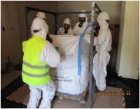 A group of laboratory technicians safeguarding of DDT stockpiles in large bags and sealing at ministry of health pesticide store in Jordan
