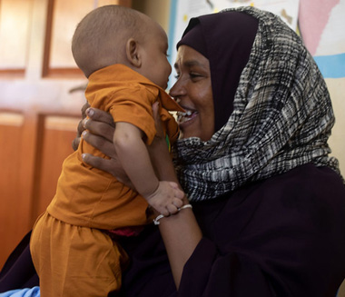 A mother and her child at a Public Health Centre of one of the drought-affected districts in Kismayo, Somalia.