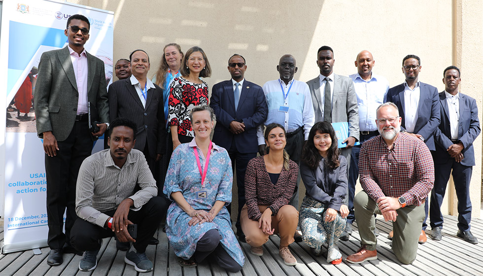 Participants from the Federal Ministry of Health, USAID/BHA and WHO Somalia pose for a group photo after a review meeting of the USAID-funded project in Mogadishu. Photo credit: WHO/Fouzia Bhatti