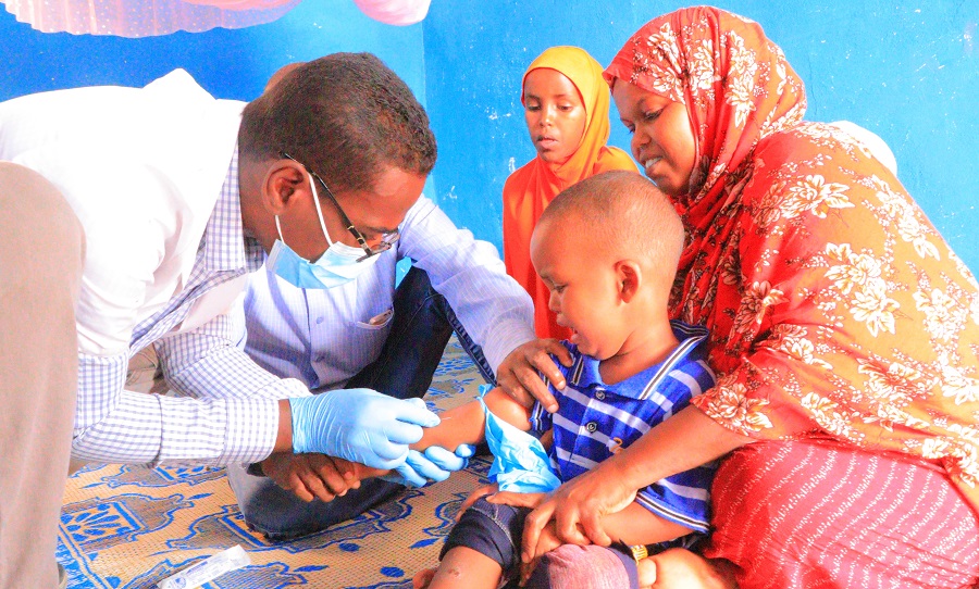 child-receives-vaccination-april