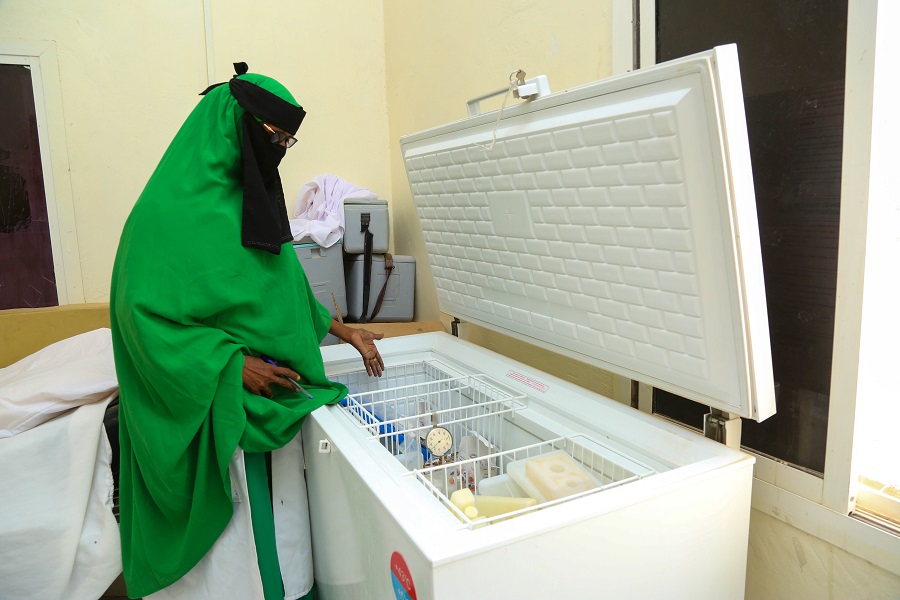 women-checks-contents-freezer