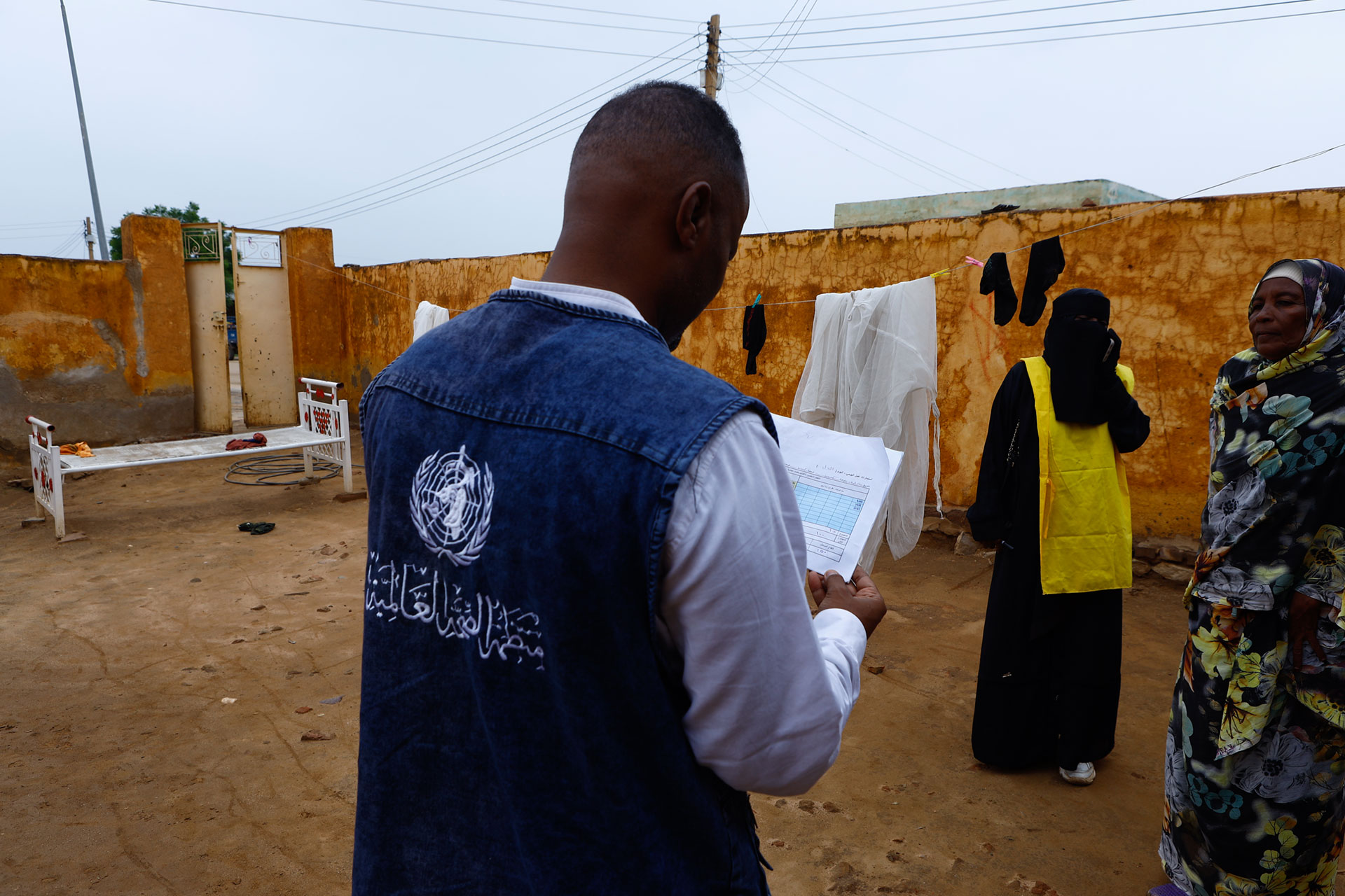 A WHO team member conducts a household survey during a field visit to support health outreach and data collection efforts in Sudan