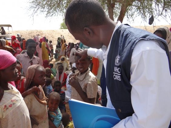 Inspecting_achild_in_Zamzam_IDPs_camp_-_new_arrivals_area