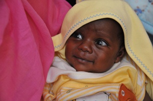 The very first infant to receive pneumococcal vaccine in a health centre in Jebel Awlia, Khartoum.