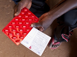 A photo of TB drugs held by a patient who is undergoing a directly-observed treatment, short course or DOTS.