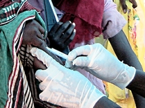 A close-up photo of a meningitis vaccine administered to a child