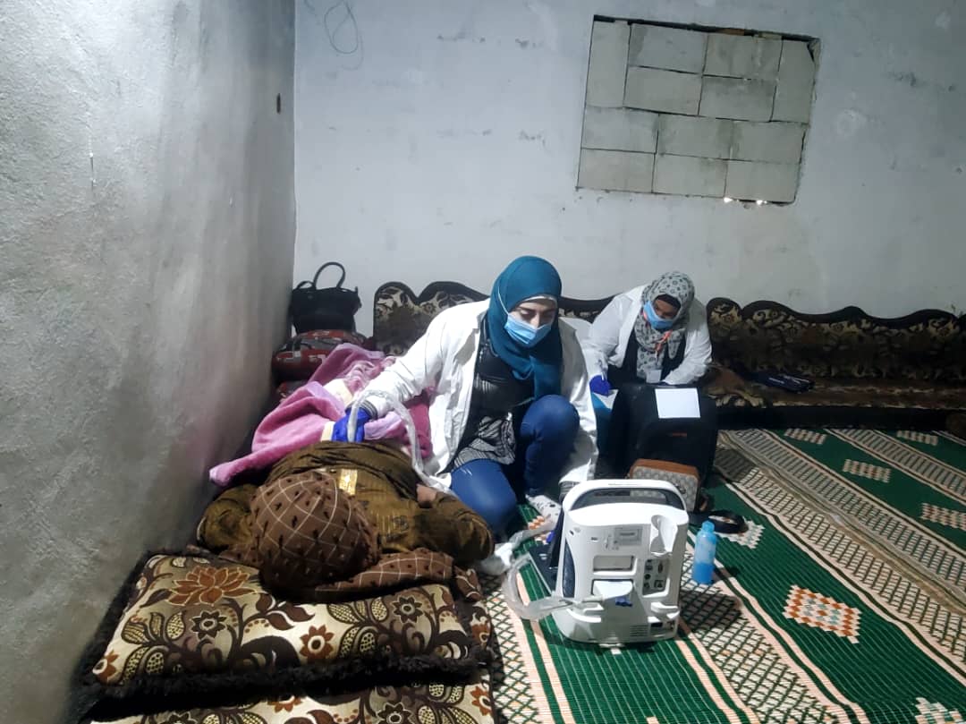 A mobile medical team from Al-Birr Association visits Samira at her home in rural Hama to provide prenatal care. Photo: WHO