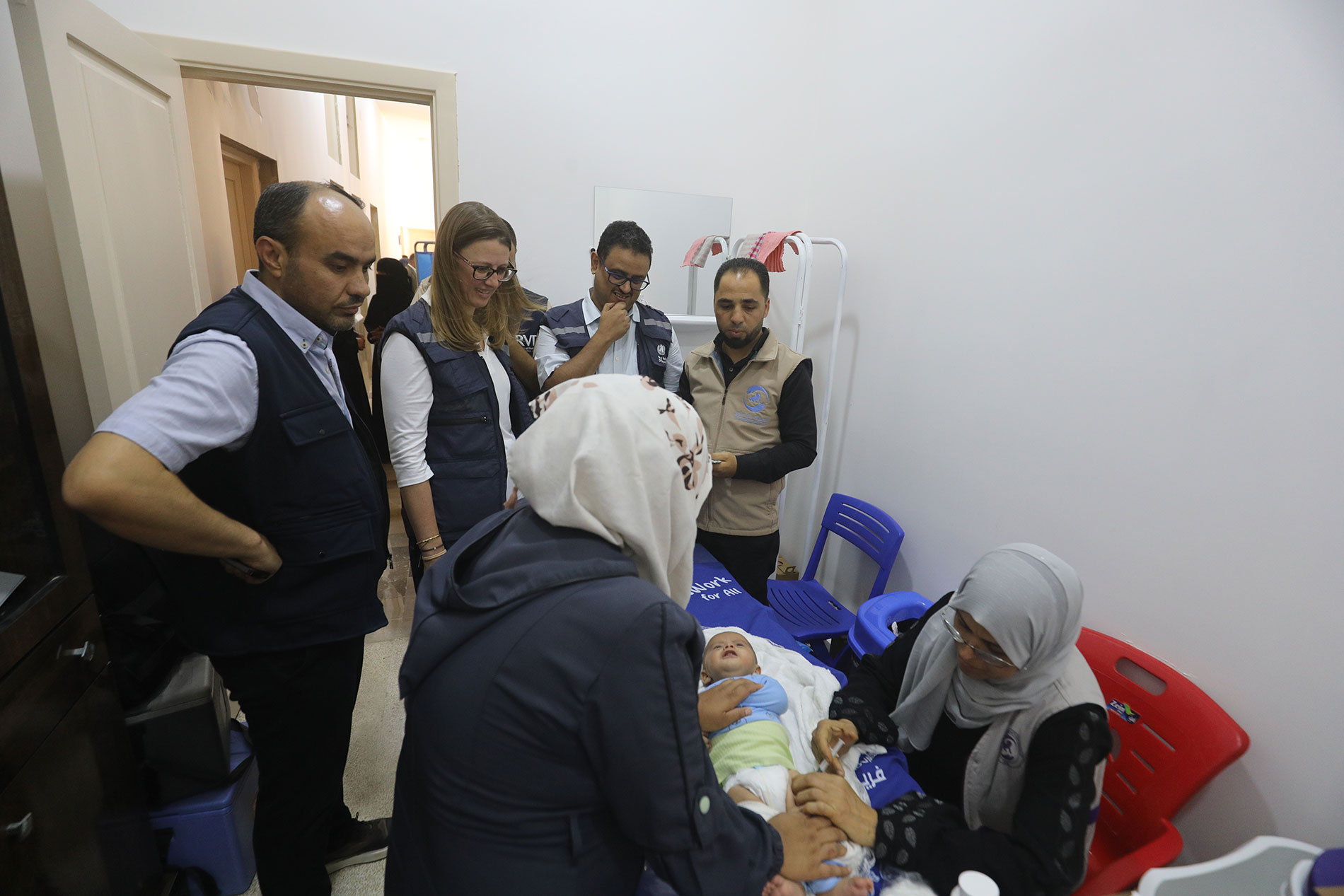 Health workers administer routine childhood immunizations at the newly reopened Ma’arrat An Nu’man public health centre, rehabilitated with support from Gavi to strengthen essential Expanded Programme on Immunization (EPI) services. Photo: WHO