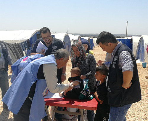 WHO-supported vaccination team is providing immunization services to children in Fafin camp for internally displaced people in rural Aleppo. Photo: WHO/Syria 2019