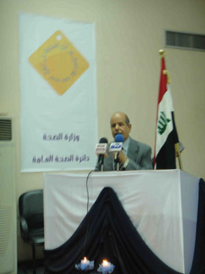 An Iraqi man standing at a podium during Iraq'a launch of the Decade for Road Safety
