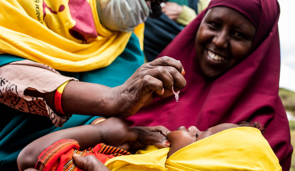 Child receives integrated measles/polio vaccine