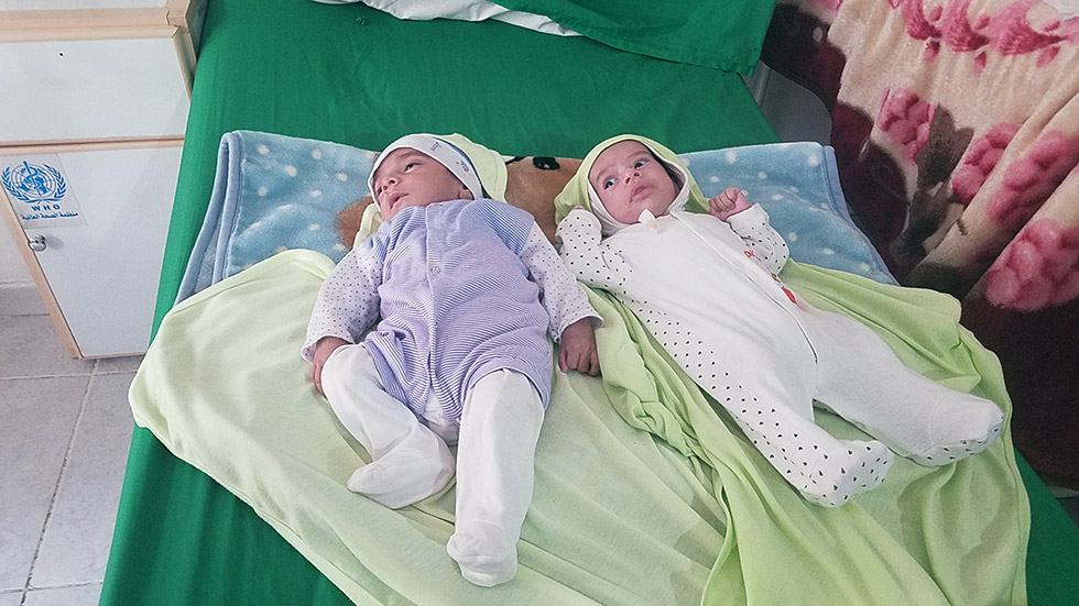 Ahmed and Qaed, 2-month-old twins from Ibb, suffered from severe acute malnutrition. They were admitted at a WHO-supported therapeutic feeding centre in Sana'a. Their condition improved after one week of treatment.