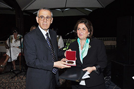 Dr Ala Alwan handing the award of the Dr A.T. Shousha Foundation Prize to Dr Abla Sebai from Lebanon