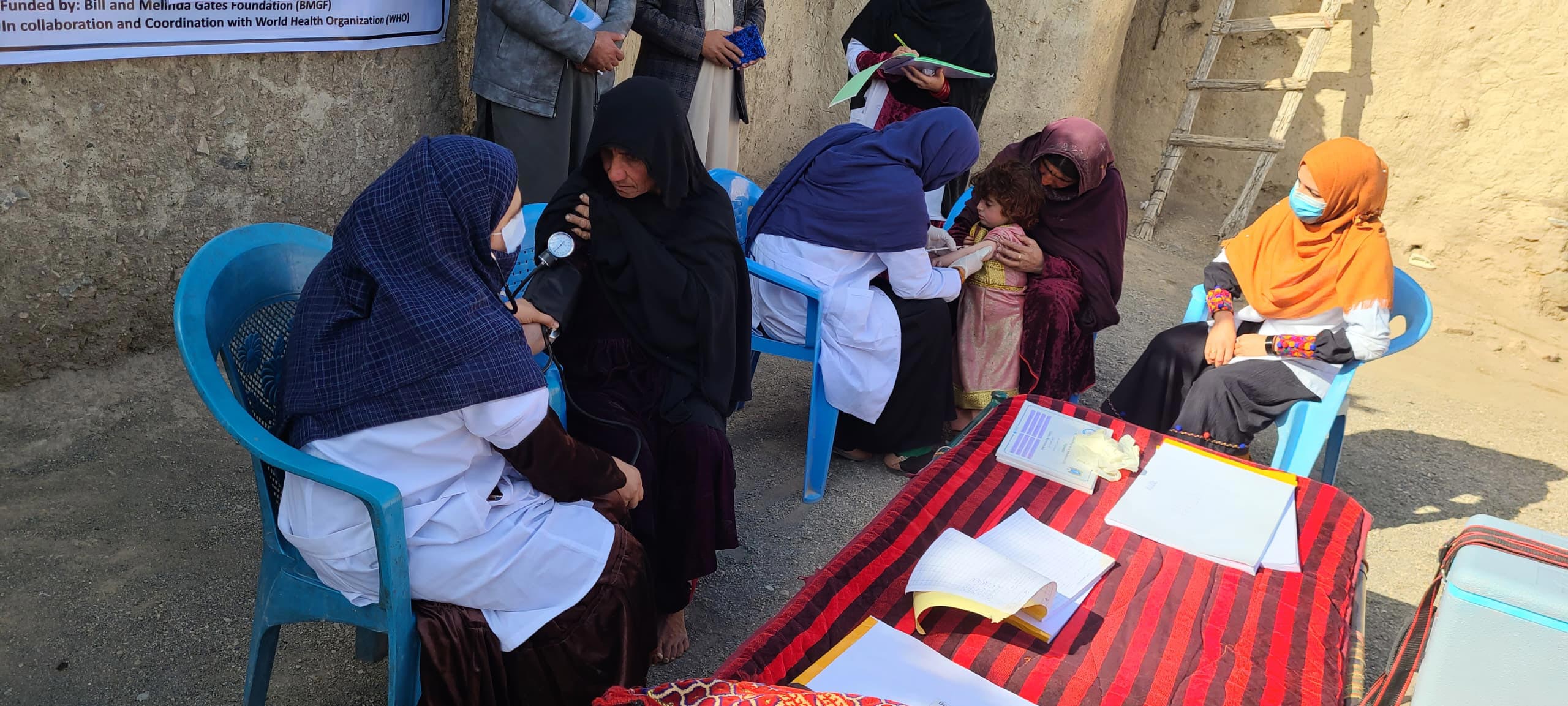 Women health workers providing essential care and vaccinations in a remote community clinic Women health workers providing essential care and vaccinations in a remote community clinic