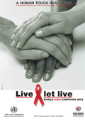 An image of the cover of the World AIDS Day 2002 brochure showing a photo of three hands touching each other and saying 'Live and let live' and 'A human touch heals pain'