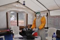 Health_worker_in_tent_in_PPE
