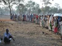 People forming a long line in Maban County, South Sudan, to receive oral cholera vaccination during a mass vaccination campaign