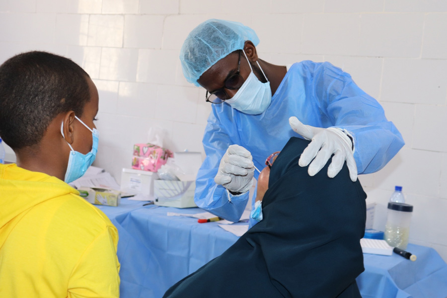 Somali doctor taking COVID virus swab