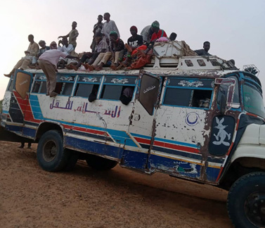 Mohamed Al Hassan Hasab Allah boards a public bus carrying AFP samples for the 5-day drive from Kosti in White Nile to Dongola in Northern State